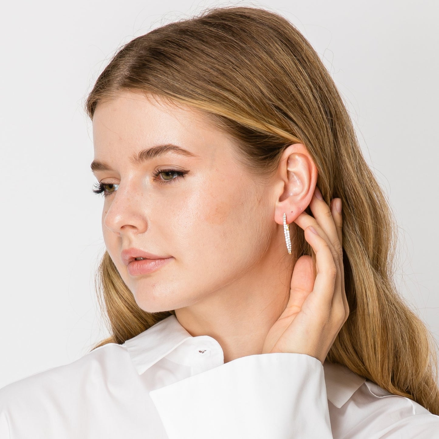 feminine gold earrings with crystals  